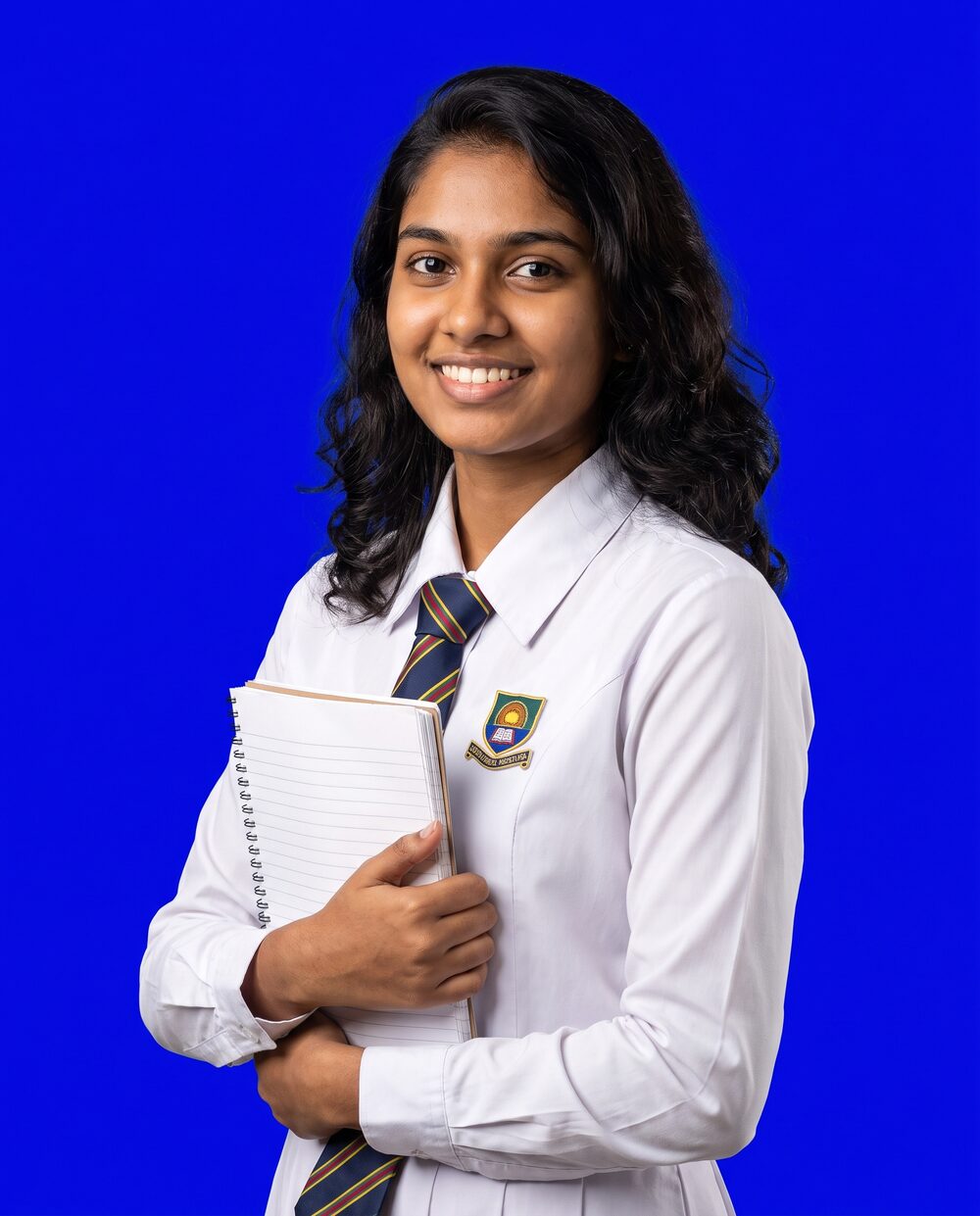 Confident A/L student holding a notebook
